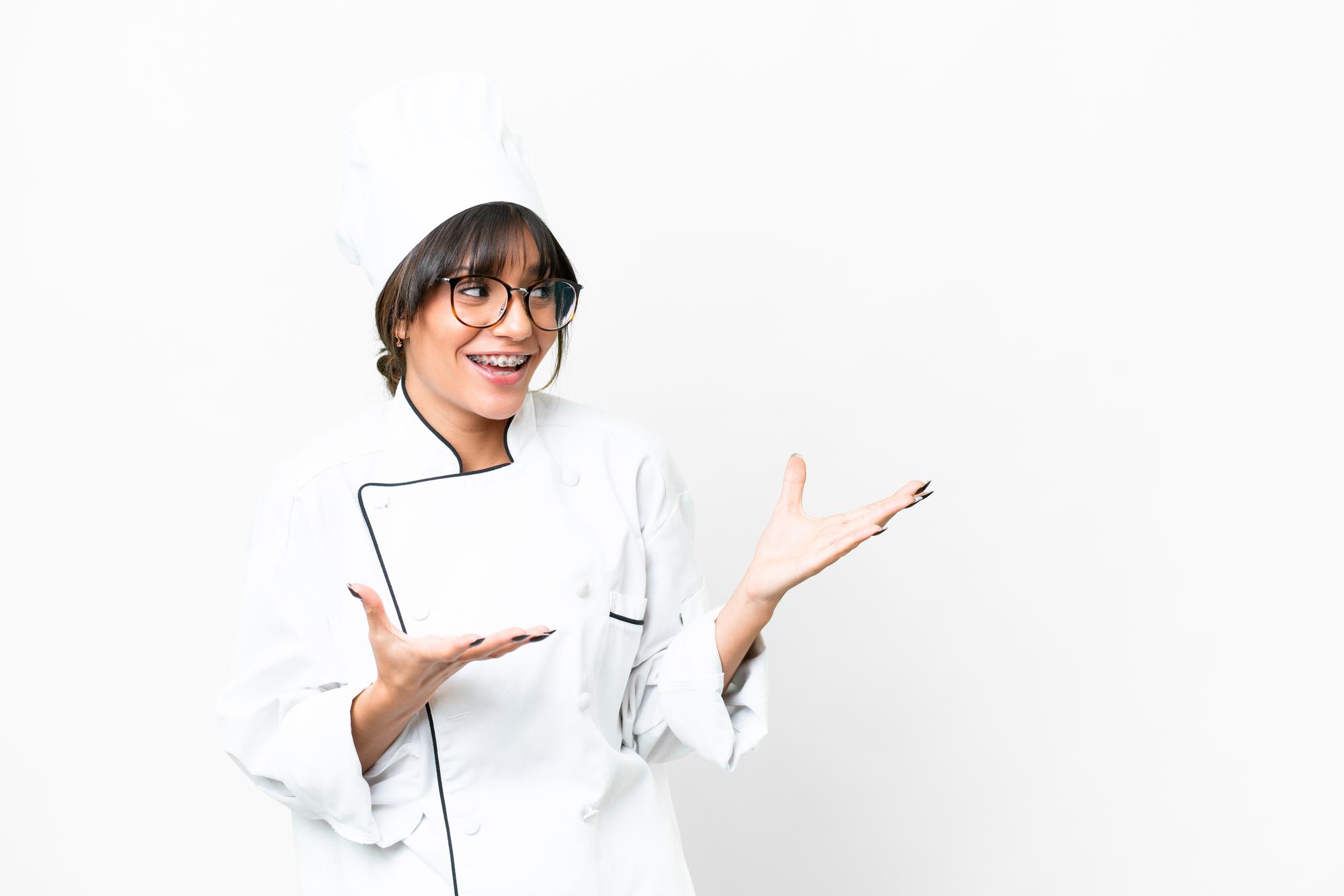 Student receiving feedback on plated dish